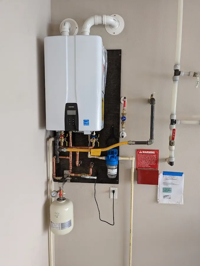 Professional plumber installing copper piping in a South Patrick Shores home